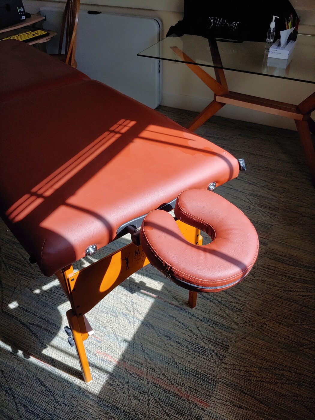 A massage treatment table in natural light